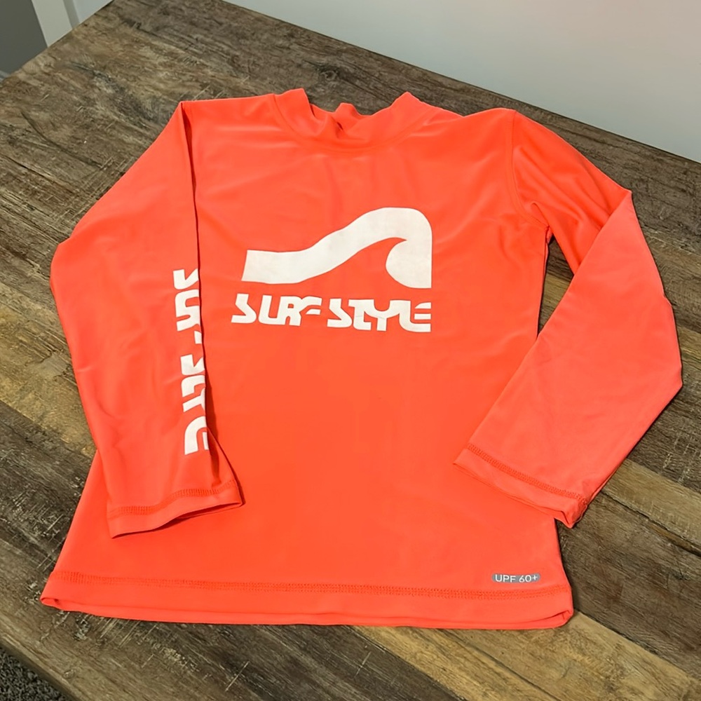 Surf style UPF, 60+ rash guard shirt.